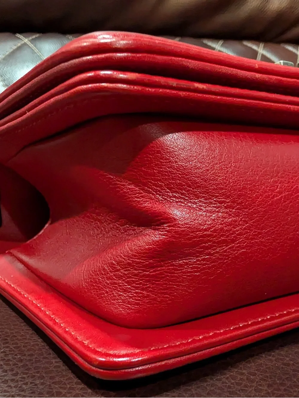 CHANEL Red leather small Boy with gunmetal tone chain